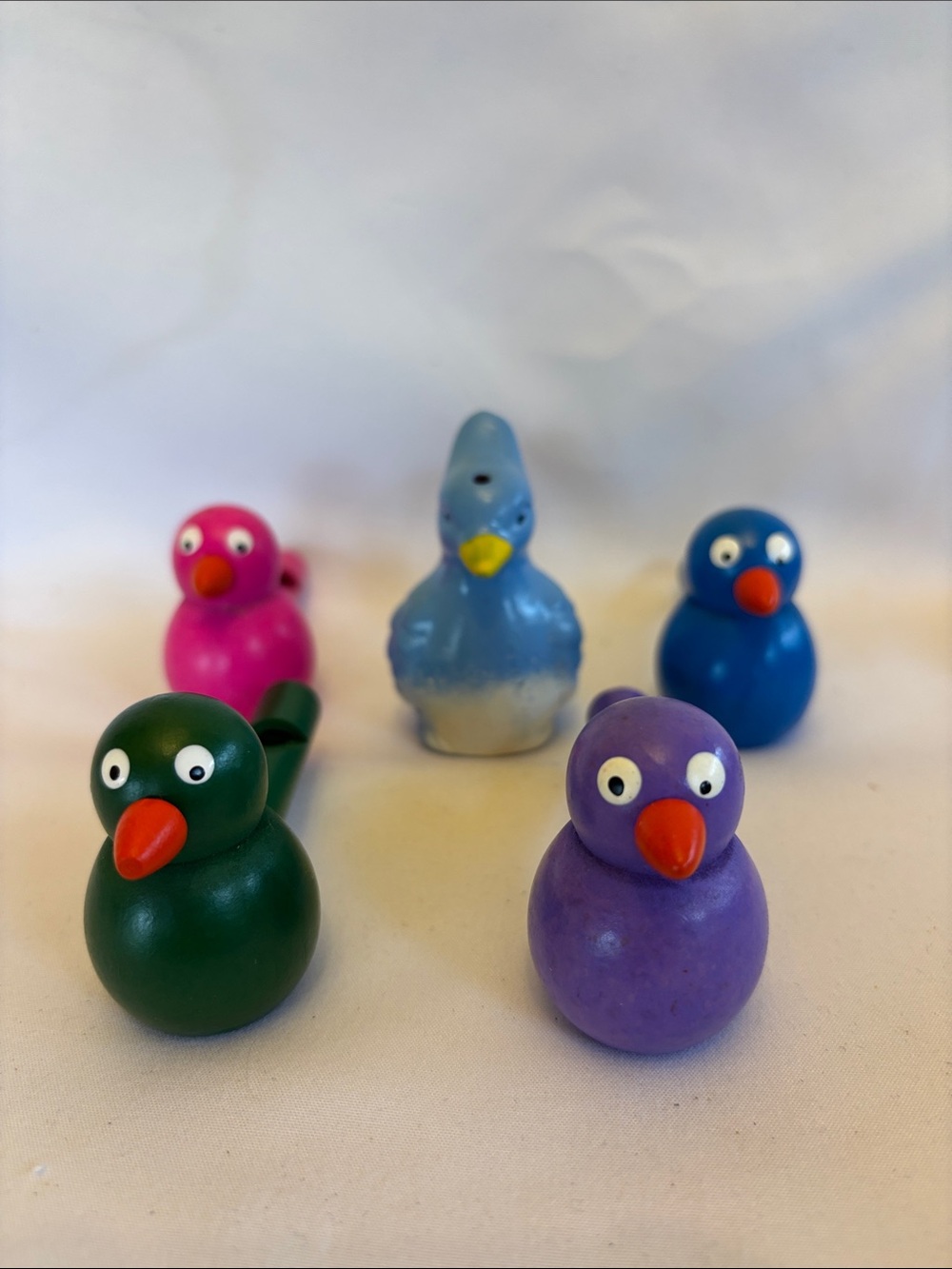 SET OF 4 COLORFUL WOODEN WHISTLES BLUE,GREEN ,PURPLE ,PINK &1 BLUE CLAY WHISTLE - Picture 4 of 8